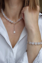 Load image into Gallery viewer, Person wearing a pearl necklace and bracelet with a white shirt.
