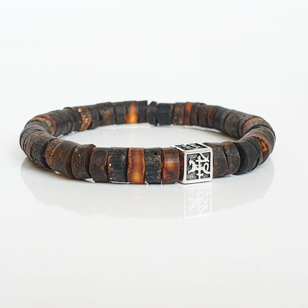 Wooden beaded bracelet with a silver clasp on a white background