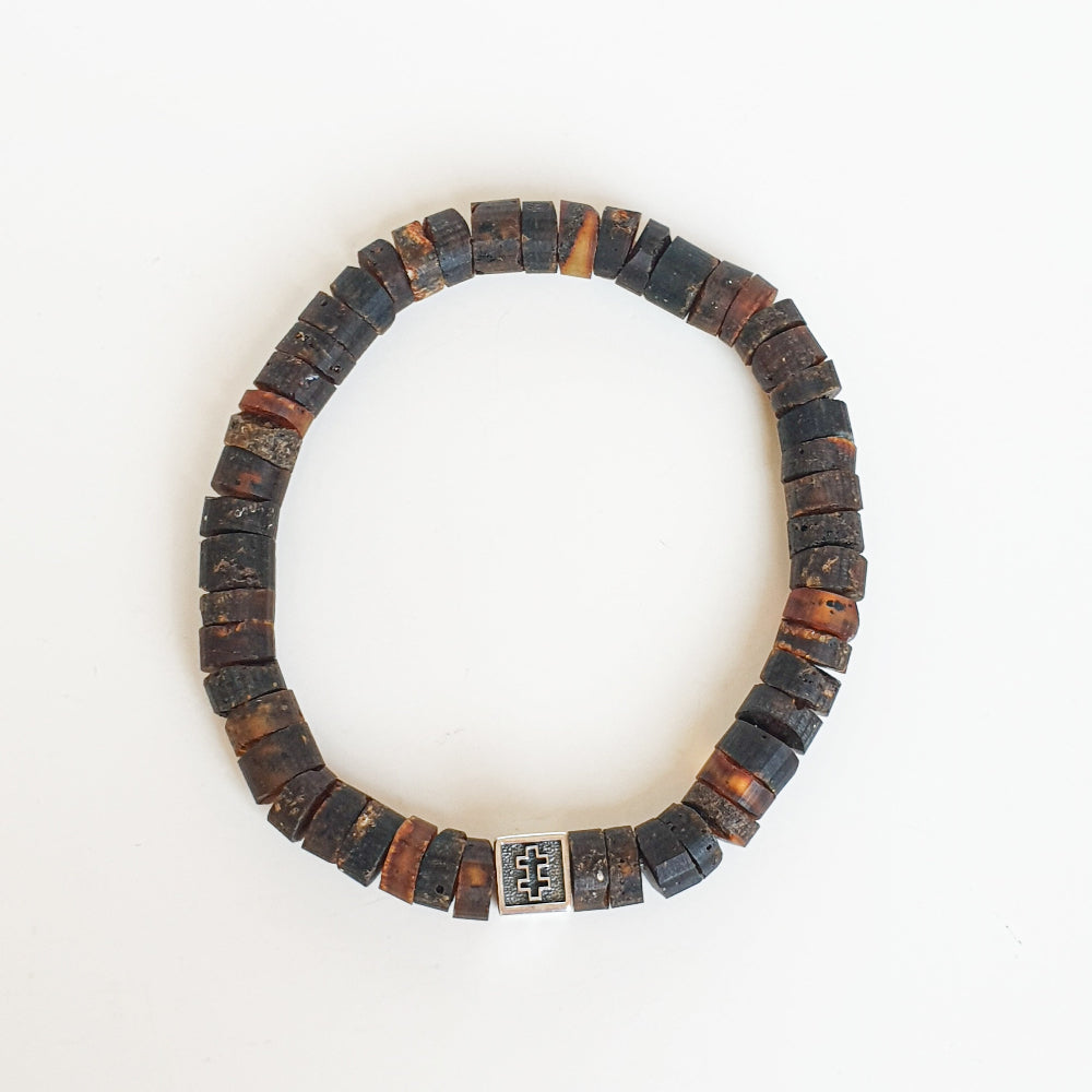 Bracelet with dark brown and black beads on a white background
