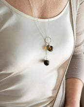 Load image into Gallery viewer, Necklace with amber beads worn by a person in a white tank top